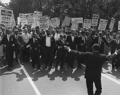 Photo of Civil Rights march with Dr. Martin Luther King Jr. in the leading row